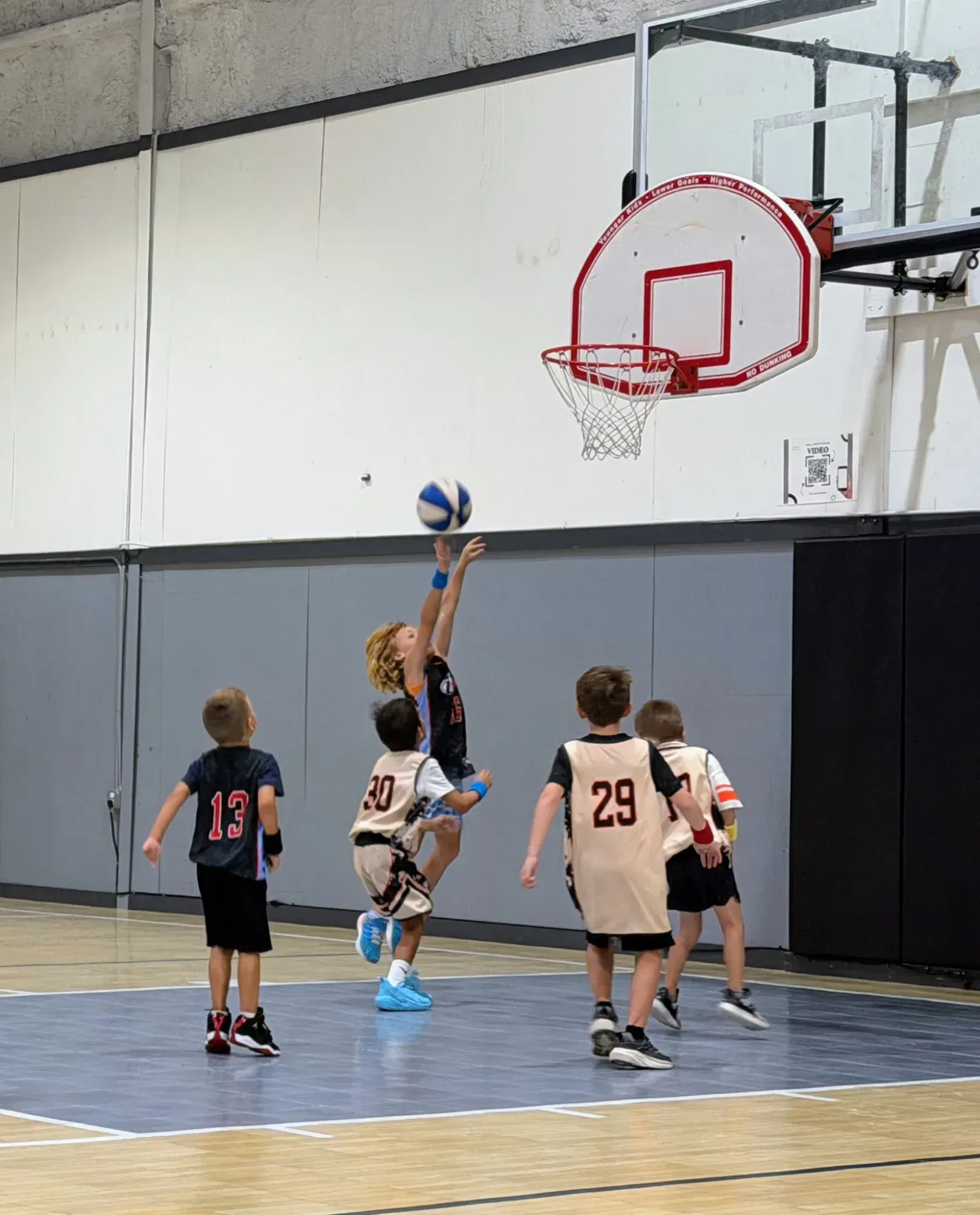 A beginner basketball player leaving the court after a game