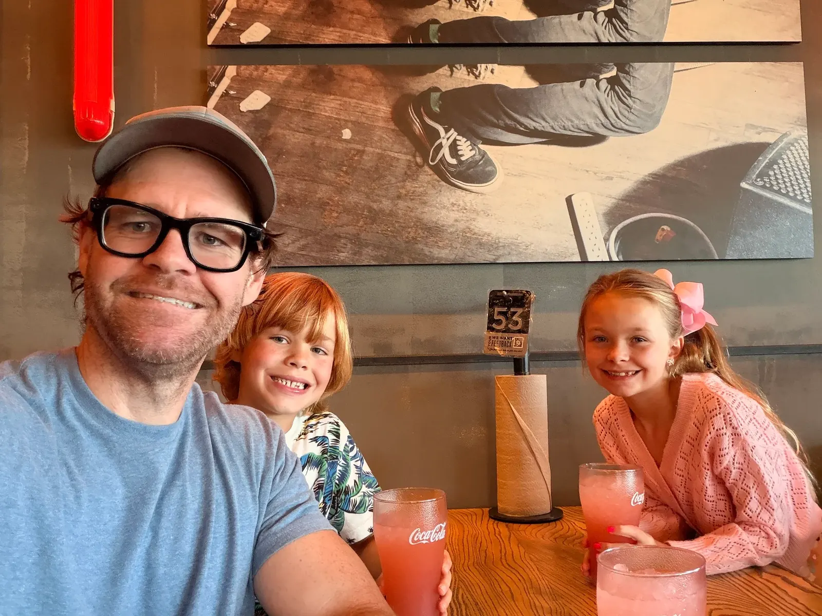 TJ Larkin with his children at the Hopdoddy Leander friends-and-family opening
