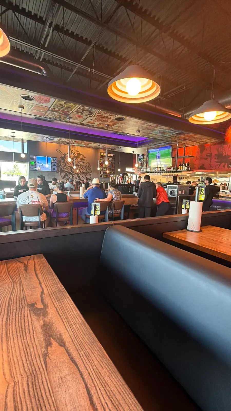 Dining room, booths and center bar inside the new Hopdoddy in Leander