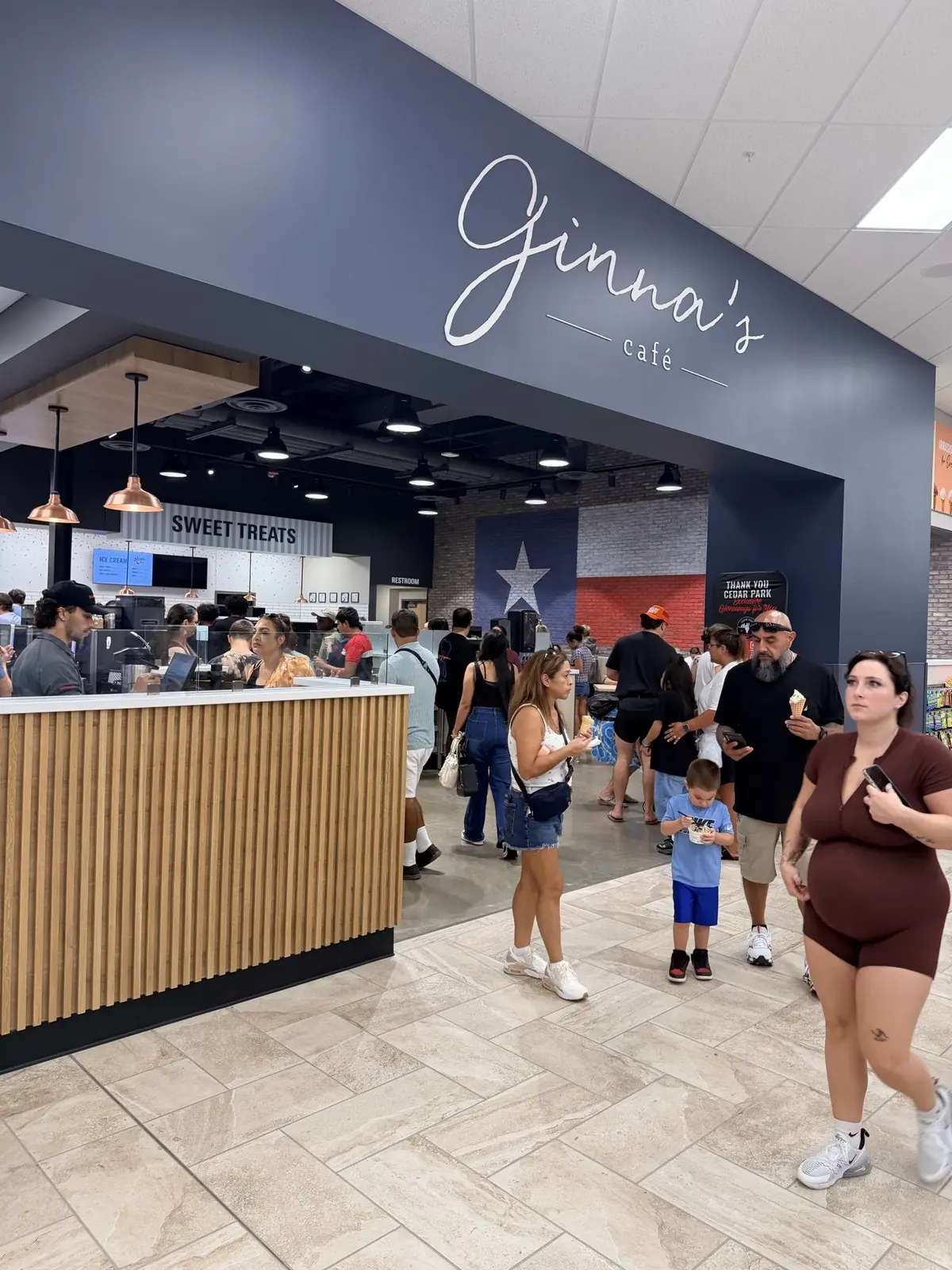 Shoppers at Ginna's Cafe and the Sweet Treats counter inside Cedar Park SCHEELS