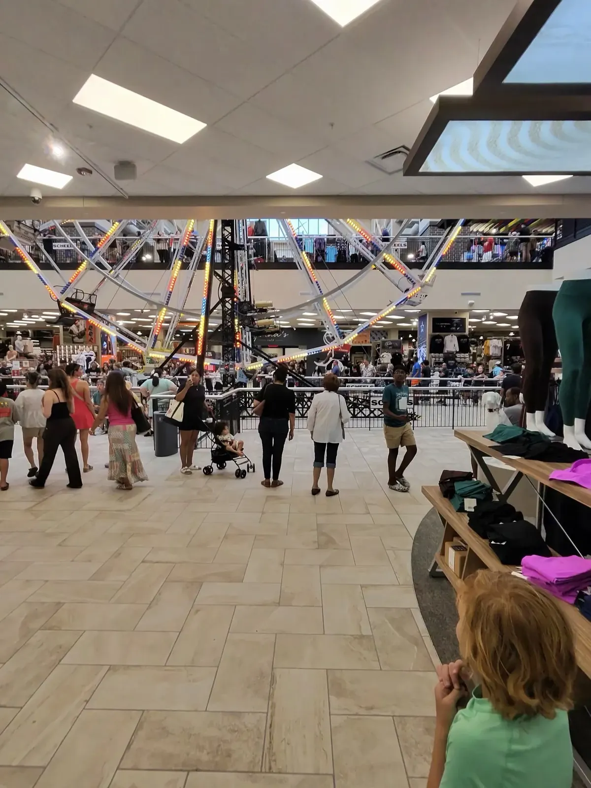 The two-story interior of Cedar Park SCHEELS with the Ferris wheel at its center