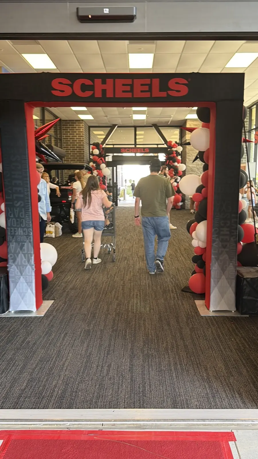 Shoppers arriving at the Cedar Park SCHEELS entrance on opening day